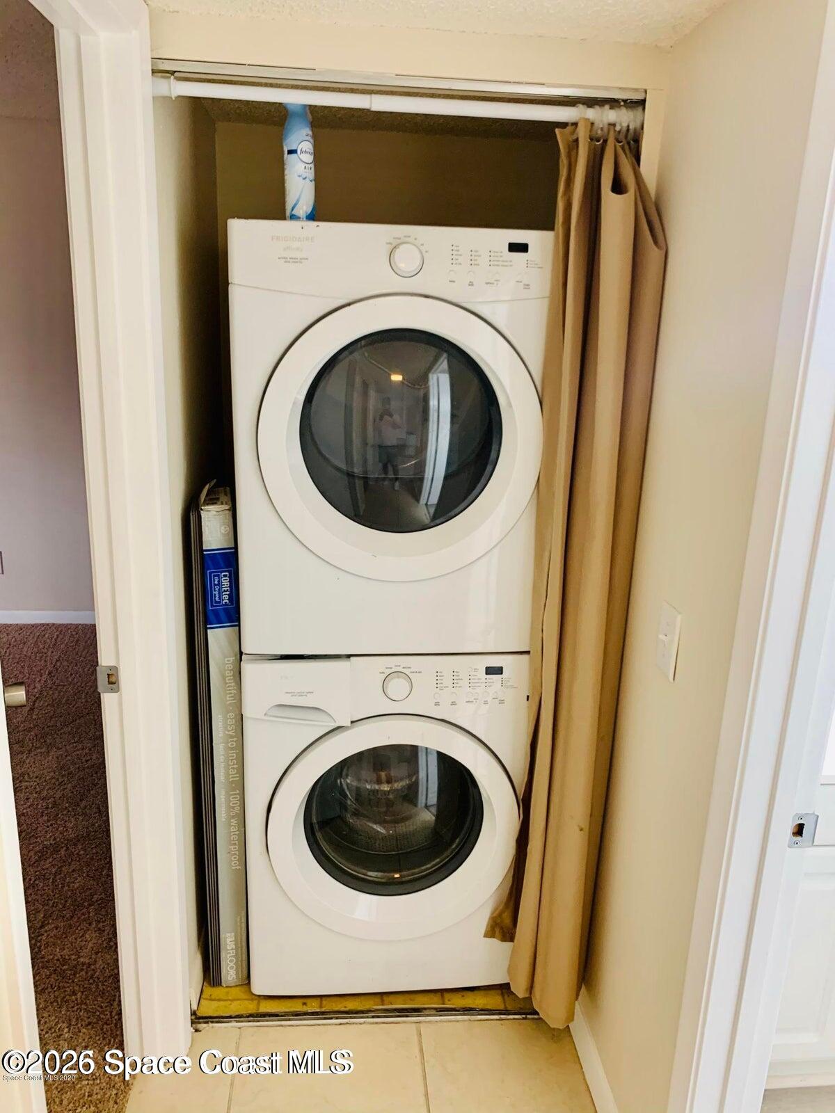 1648 Sunny Brook Lane, Unit M202 Palm Bay, FL 32905 - Photo 13 of 15 a utility room with dryer and washer