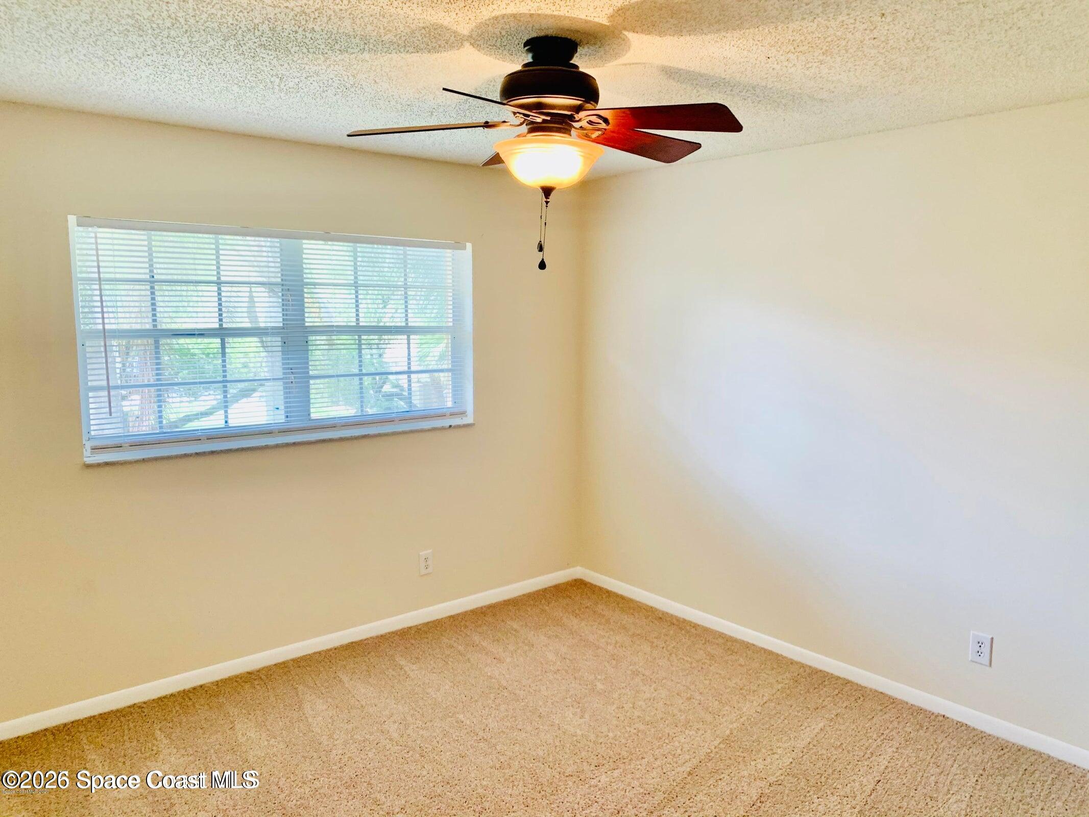 1648 Sunny Brook Lane, Unit M202 Palm Bay, FL 32905 - Photo 10 of 15 a view of empty room