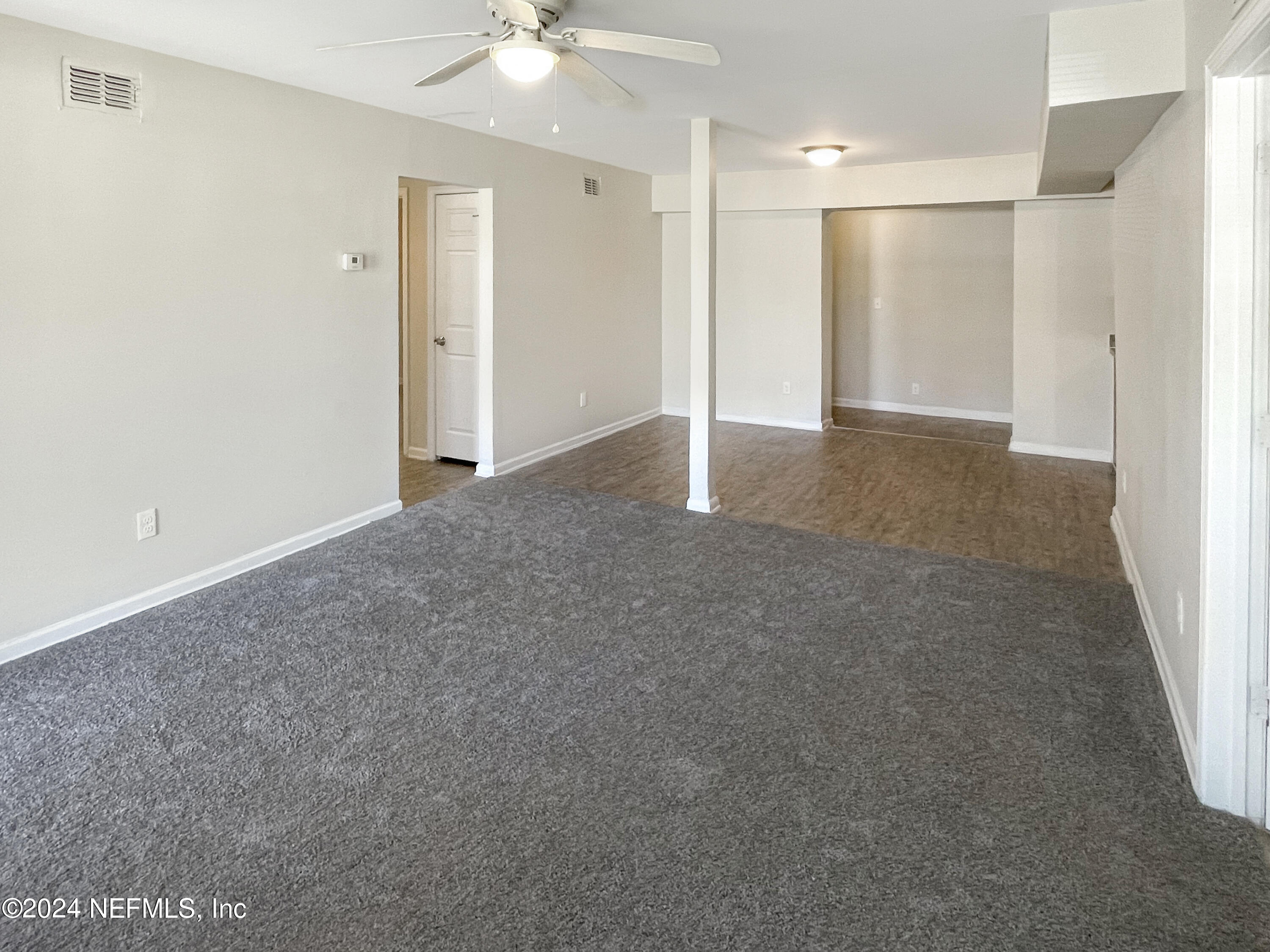 4814 Hatteras Road Jacksonville, FL 32208 - Photo 3 of 27 an empty room with a bathroom