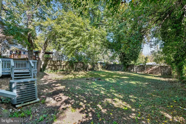 a view of deck with wooden floor and fence