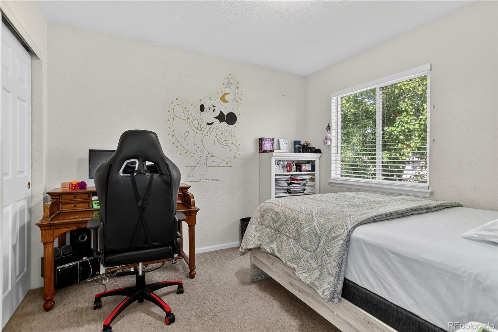 20000 East Mitchell Place, Unit 71 Denver, CO 80249 - Photo 12 of 28 a bedroom with a bed and a desk
