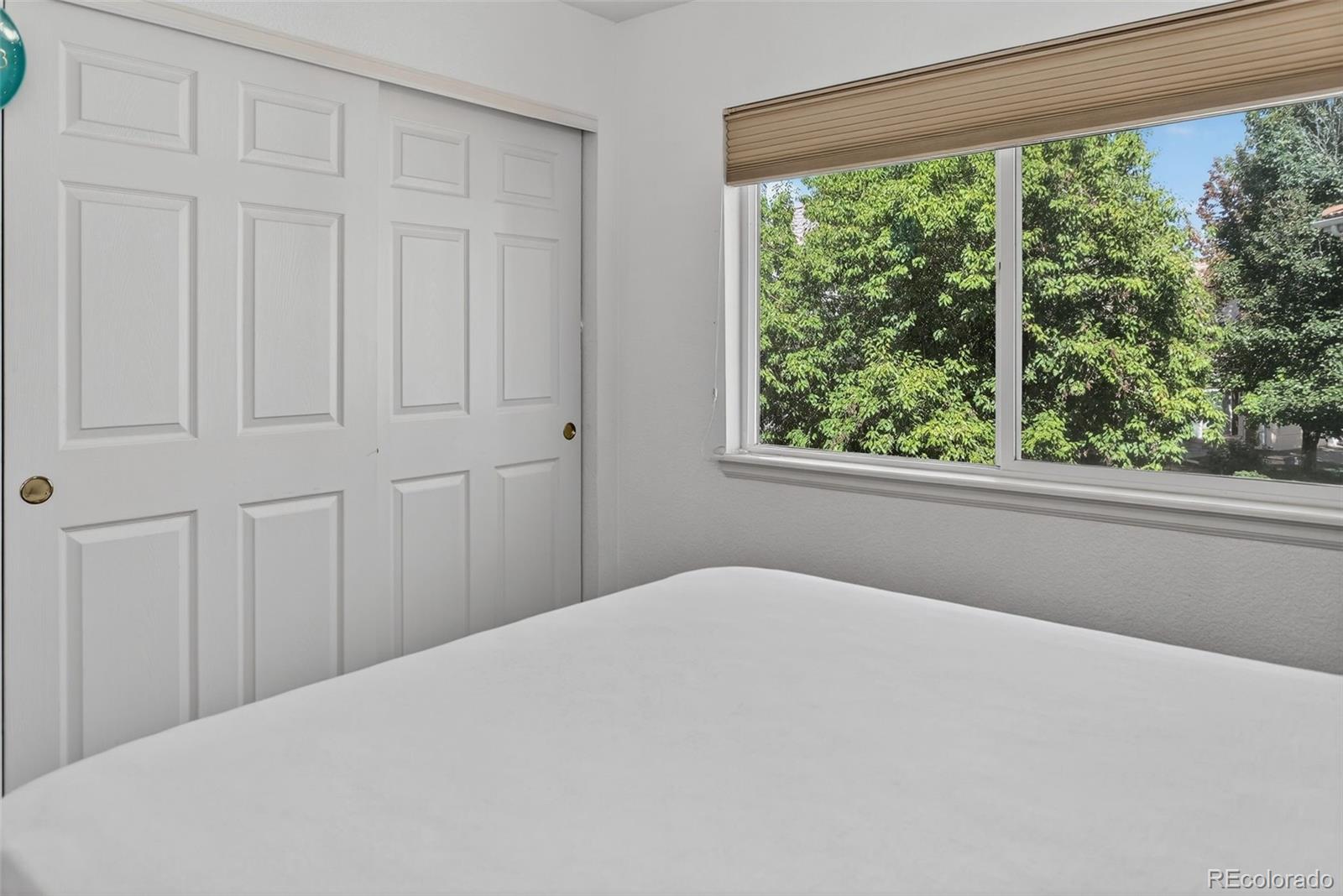 20000 East Mitchell Place, Unit 71 Denver, CO 80249 - Photo 14 of 28 a bedroom with a bed and a window