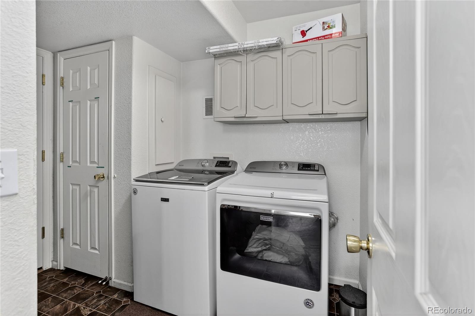 20000 East Mitchell Place, Unit 71 Denver, CO 80249 - Photo 16 of 28 a utility room with dryer and washer