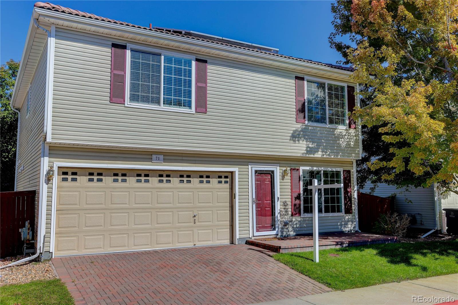 20000 East Mitchell Place, Unit 71 Denver, CO 80249 - Photo 2 of 28 front view of a house with a yard