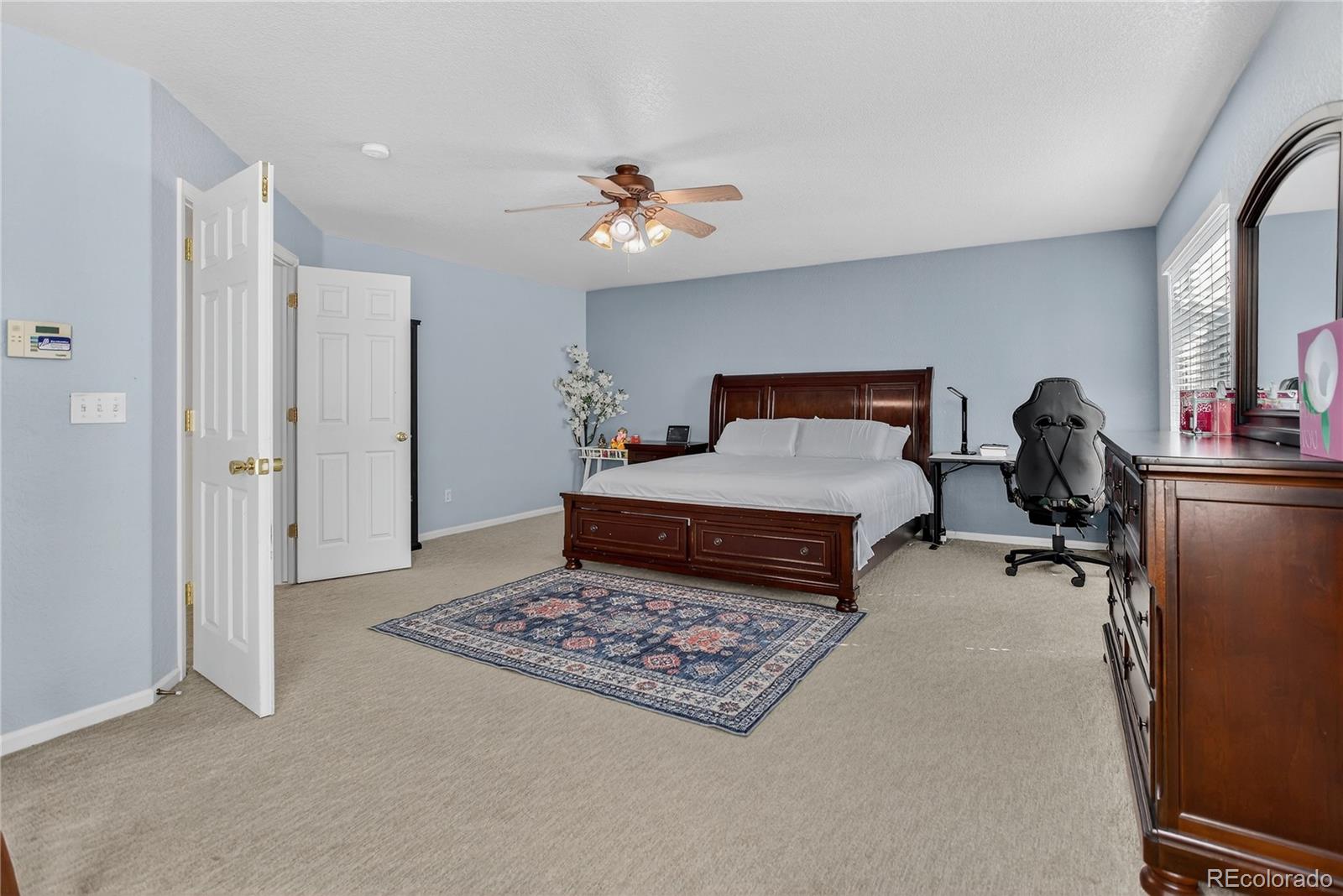 20000 East Mitchell Place, Unit 71 Denver, CO 80249 - Photo 22 of 28 a living room with furniture and a rug