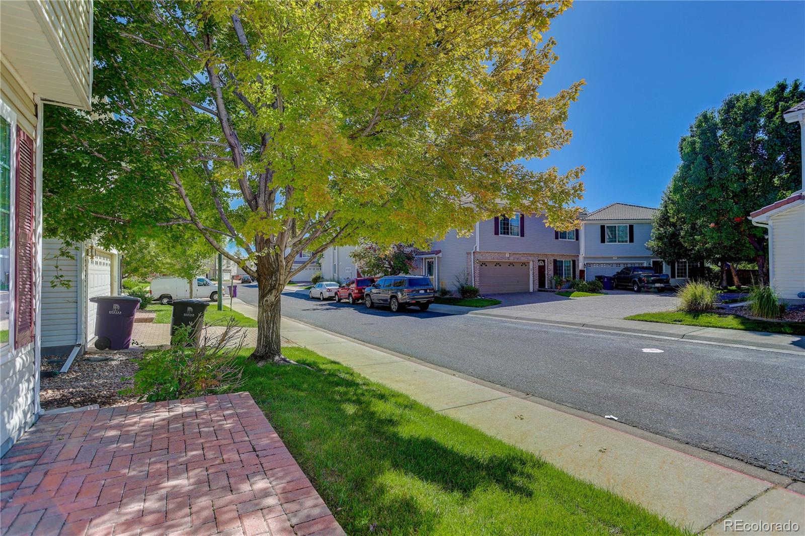 20000 East Mitchell Place, Unit 71 Denver, CO 80249 - Photo 25 of 28 a car parked on the side of a street