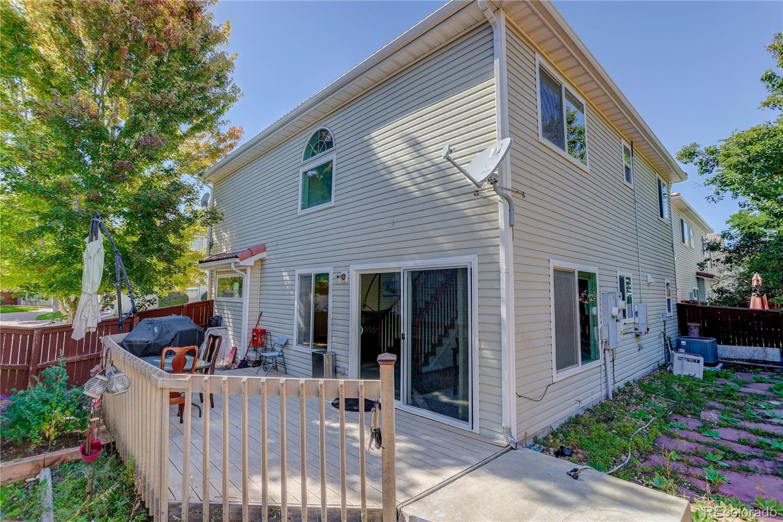 20000 East Mitchell Place, Unit 71 Denver, CO 80249 - Photo 27 of 28 a view of a house with porch and garden