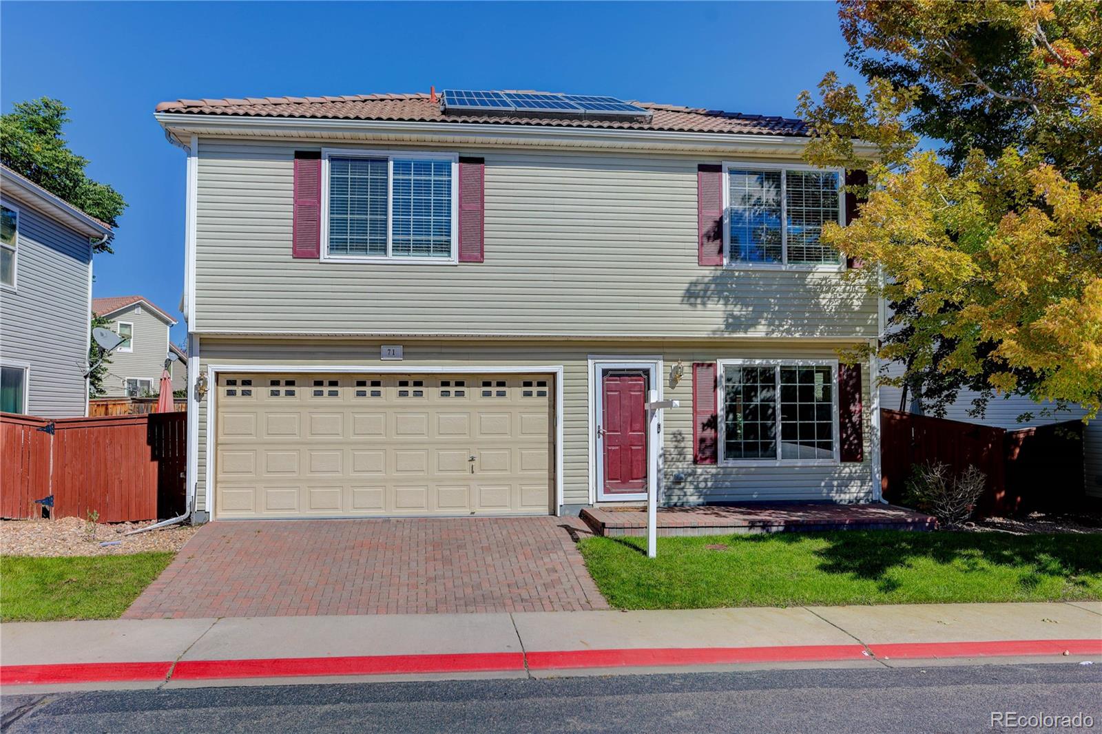 20000 East Mitchell Place, Unit 71 Denver, CO 80249 - Photo 3 of 28 a front view of house with yard