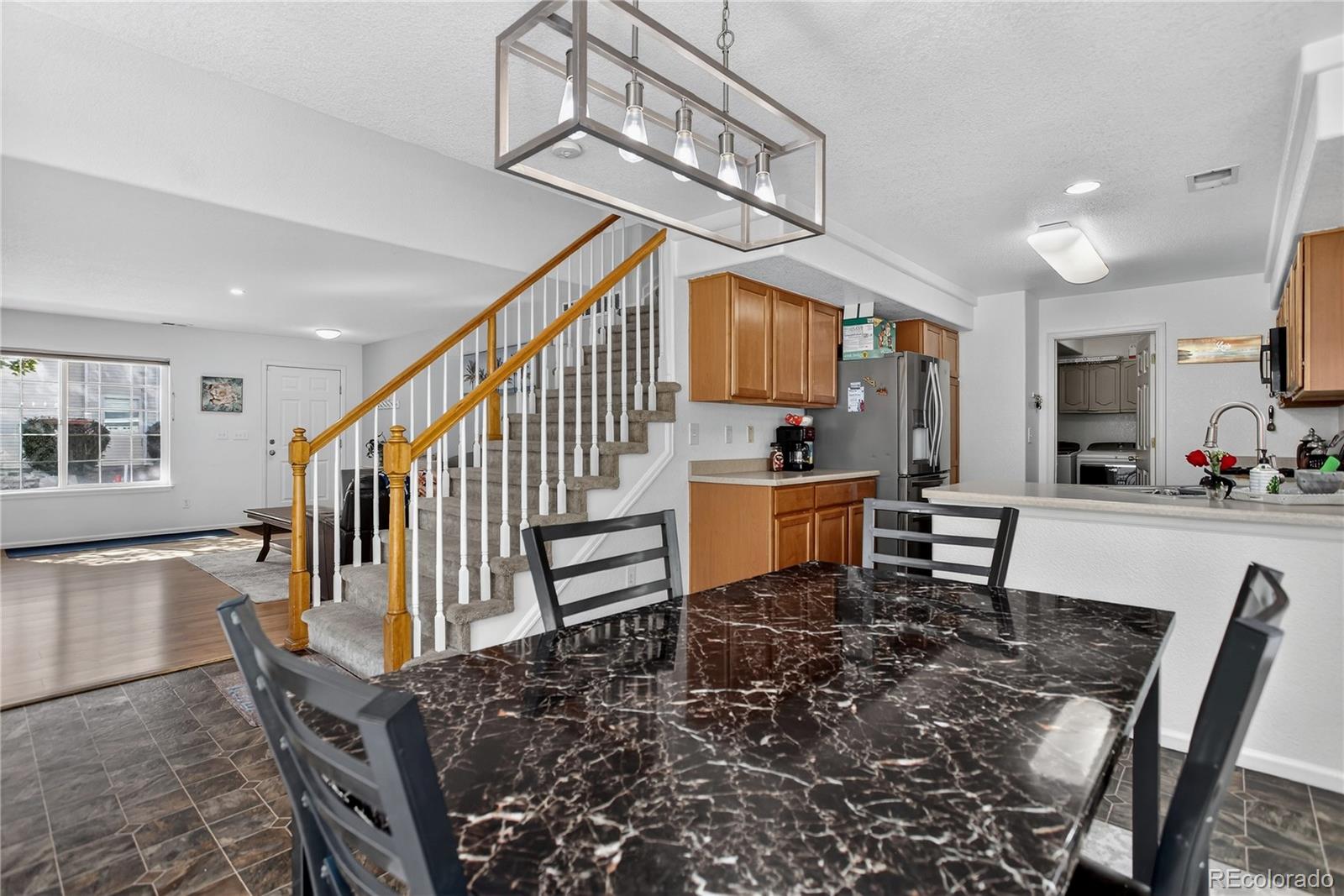 20000 East Mitchell Place, Unit 71 Denver, CO 80249 - Photo 5 of 28 a view of entryway and hall with dining room