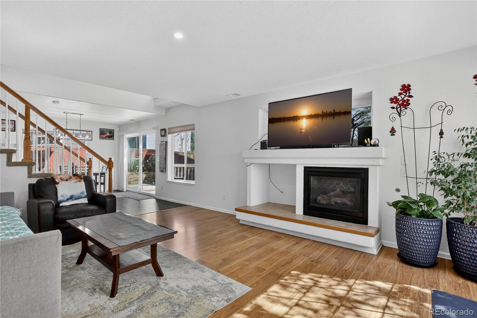 20000 East Mitchell Place, Unit 71 Denver, CO 80249 - Photo 8 of 28 a living room with furniture and a fireplace
