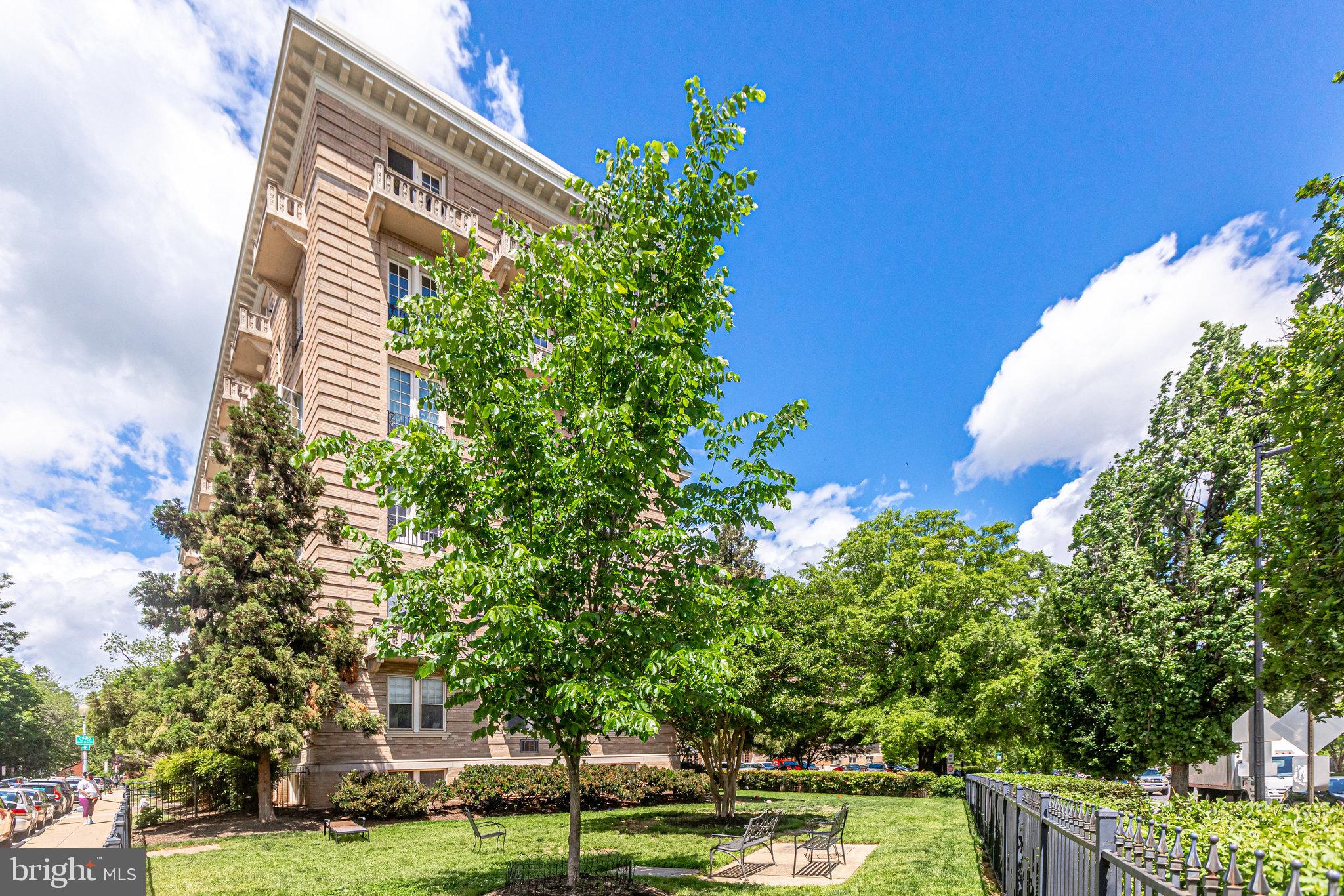 3420 16th Street Northwest, Unit 102 Washington, DC 20010 - Photo 1 of 18 a front view of a house with a yard
