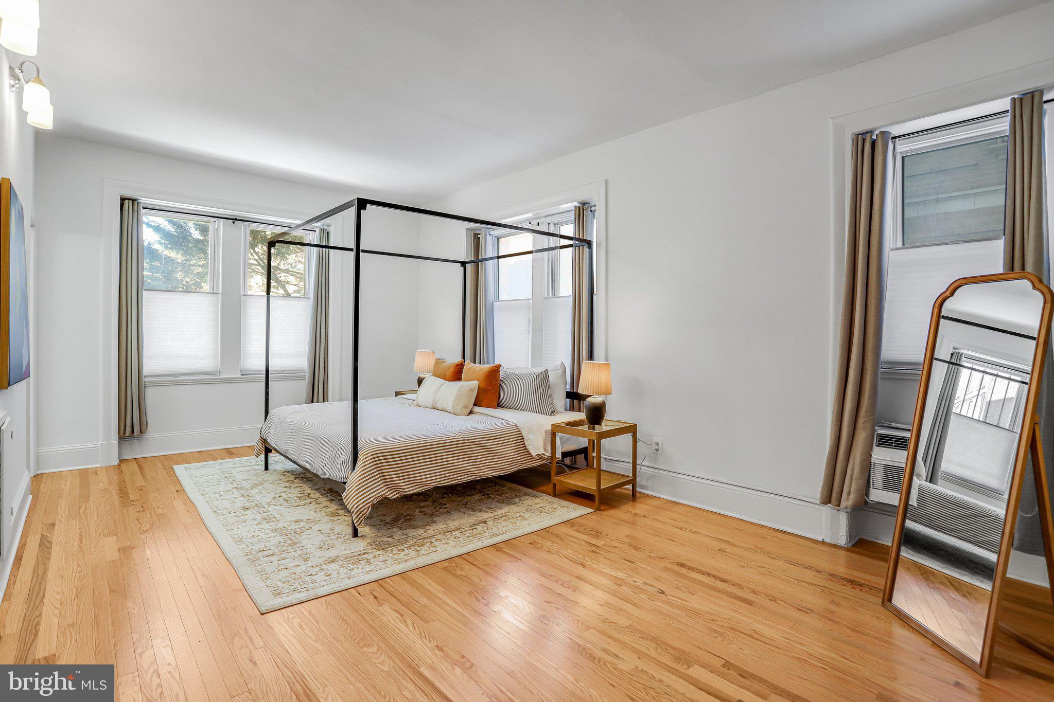 3420 16th Street Northwest, Unit 102 Washington, DC 20010 - Photo 13 of 18 a bed room with a bed and a window