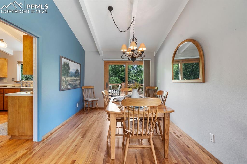 10 Haney Road Colorado Springs, CO 80906 - Photo 20 of 48 a view of a dining room with furniture window and wooden floor