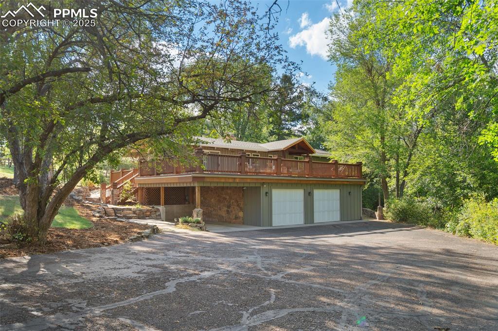 10 Haney Road Colorado Springs, CO 80906 - Photo 2 of 48 a front view of a house with a garden