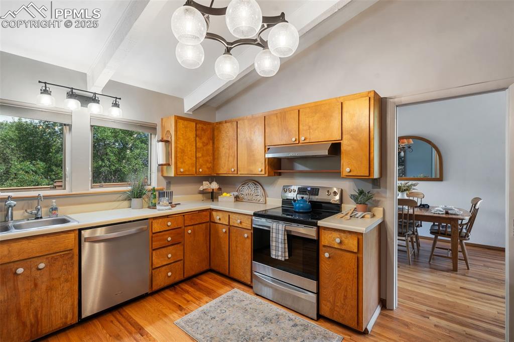 10 Haney Road Colorado Springs, CO 80906 - Photo 23 of 48 a kitchen with a sink cabinets a window and stainless steel appliances