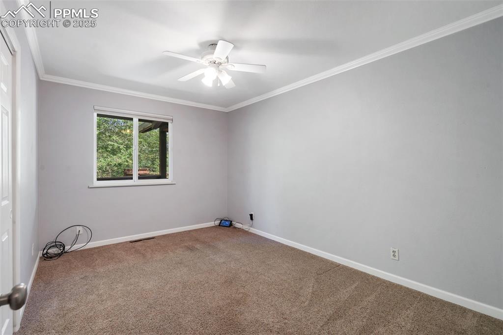 10 Haney Road Colorado Springs, CO 80906 - Photo 27 of 48 wooden floor in an empty room with a window
