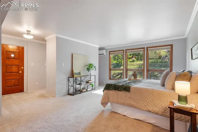 a spacious bedroom with a bed and a couch