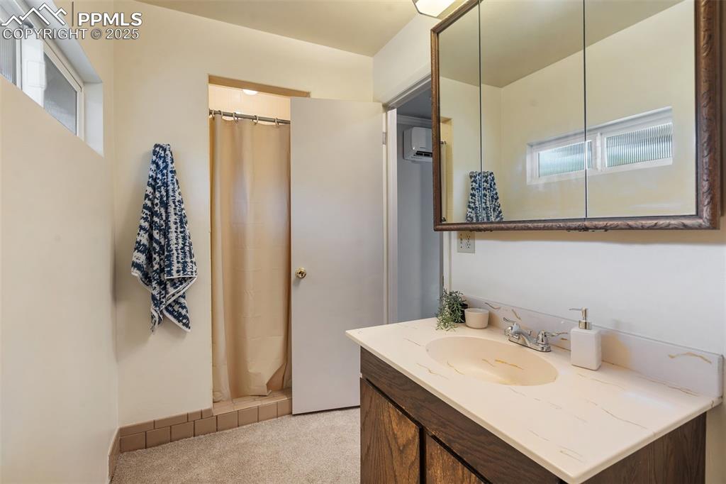 10 Haney Road Colorado Springs, CO 80906 - Photo 33 of 48 a bathroom with a sink and a mirror