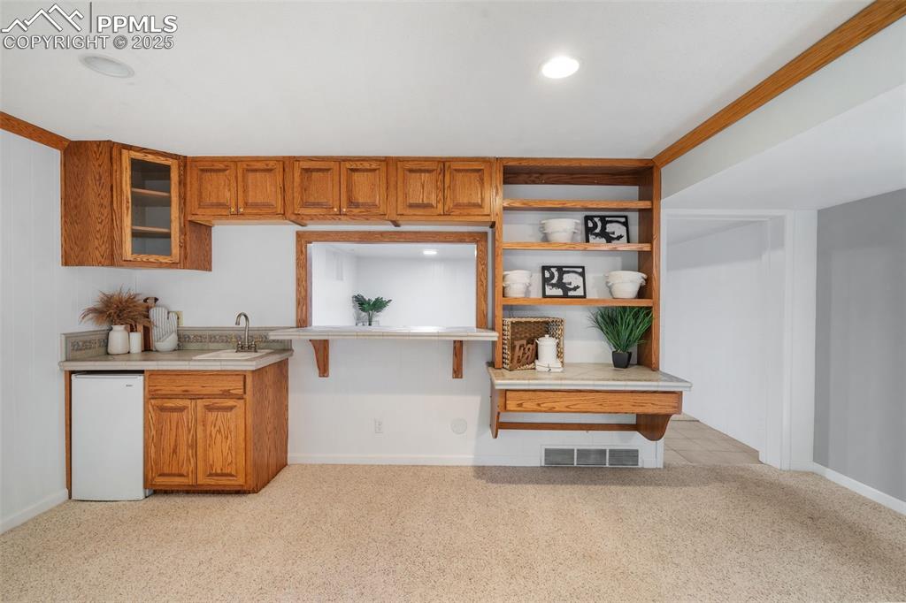 10 Haney Road Colorado Springs, CO 80906 - Photo 38 of 48 a living room with stainless steel appliances furniture a rug and a window