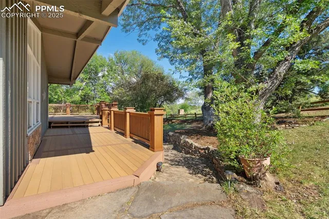 a view of a chairs and table in the balcony