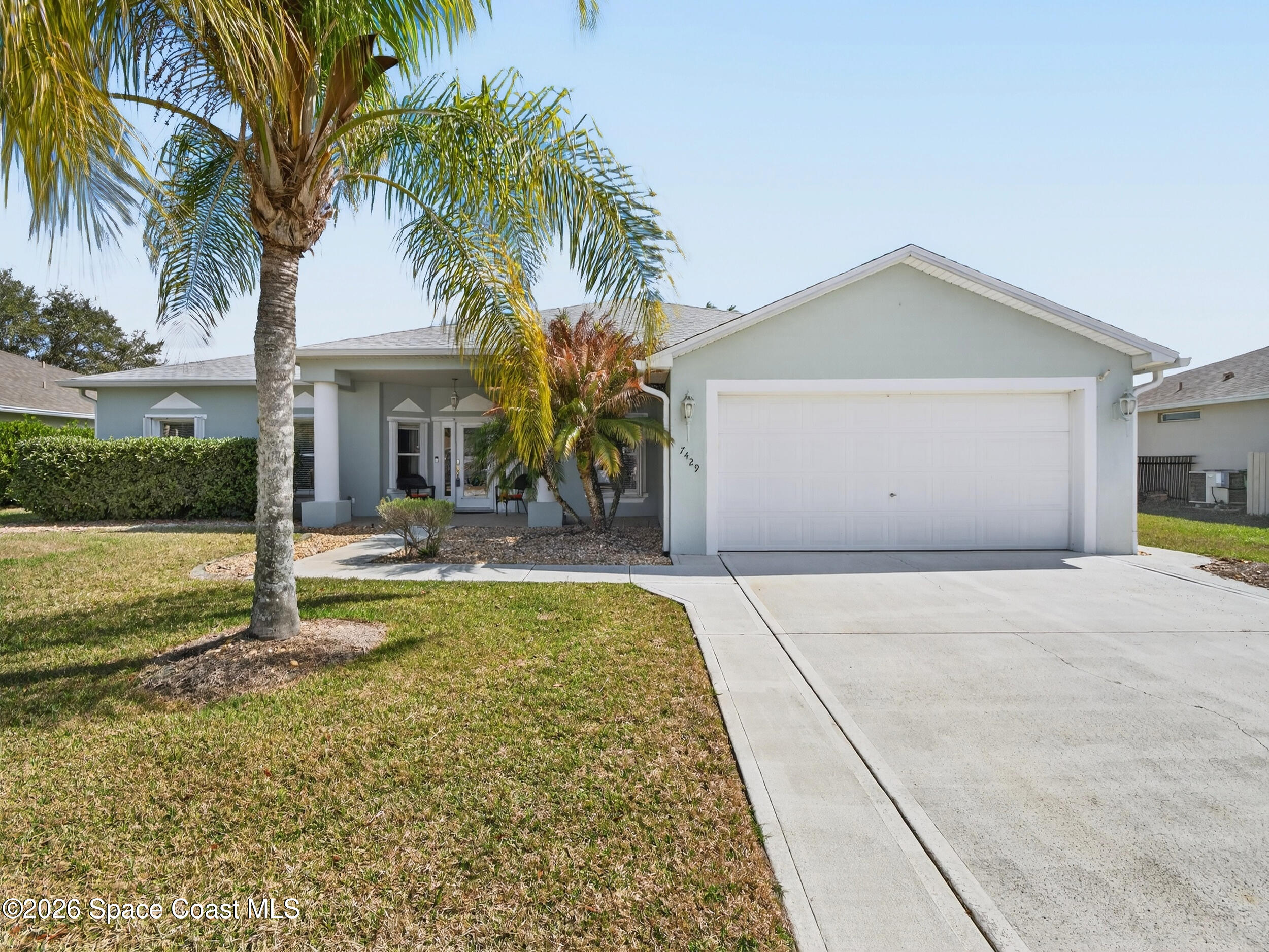 7429 Hackberry Road Cocoa, FL 32927 - Photo 1 of 51 a view of a house with a swimming pool