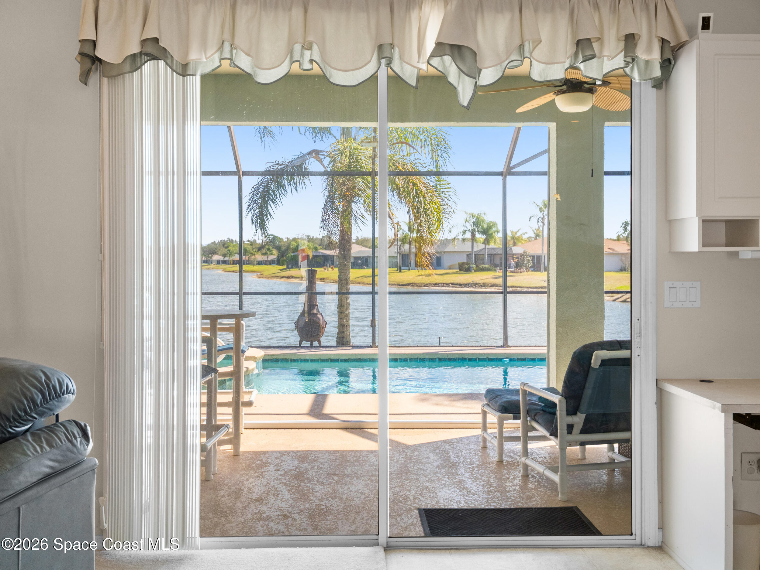 7429 Hackberry Road Cocoa, FL 32927 - Photo 14 of 51 a view of a room with a dining table and chairs