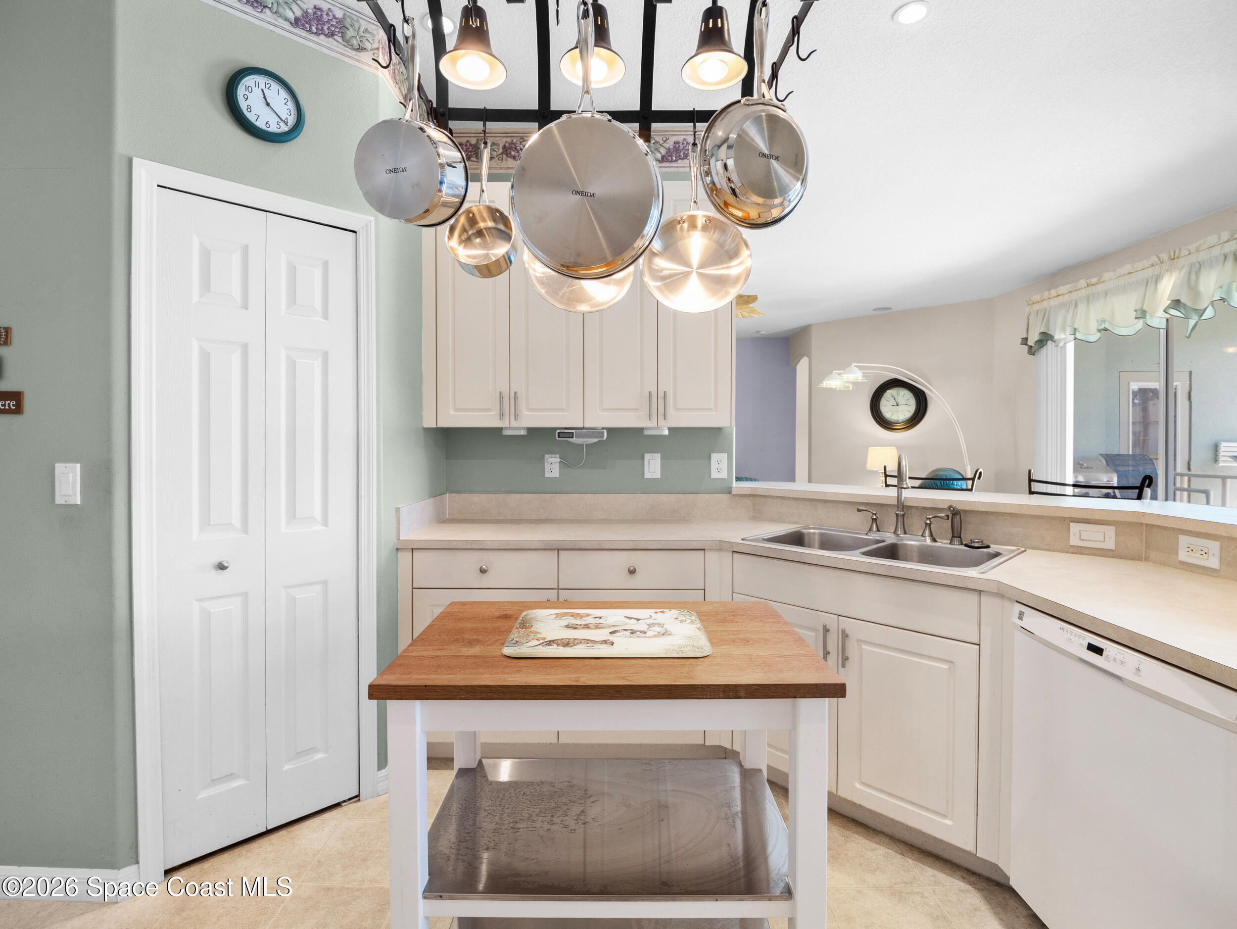 7429 Hackberry Road Cocoa, FL 32927 - Photo 19 of 51 a kitchen with a sink and a stove with a wooden floor