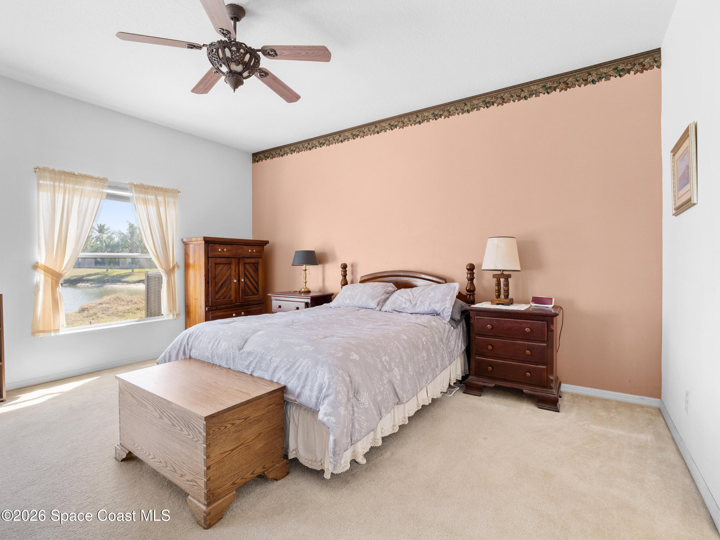 7429 Hackberry Road Cocoa, FL 32927 - Photo 22 of 51 a spacious bedroom with a bed and window