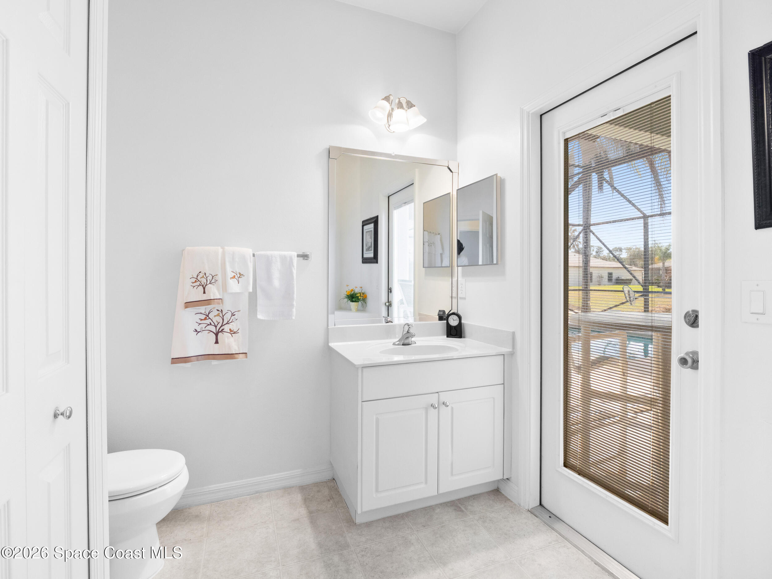 7429 Hackberry Road Cocoa, FL 32927 - Photo 31 of 51 a spacious bathroom with a toilet sink and shower
