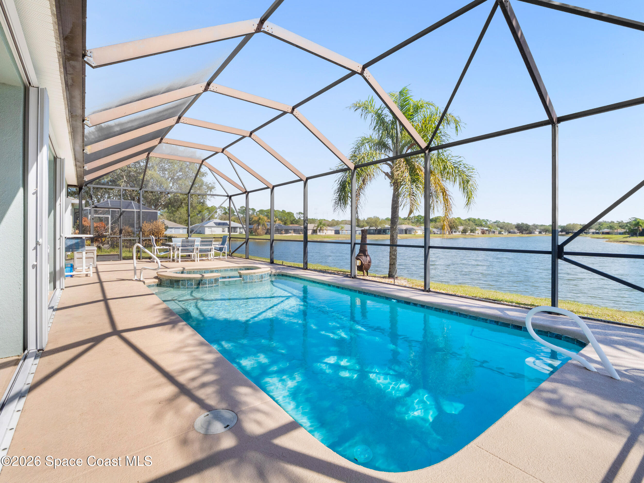 7429 Hackberry Road Cocoa, FL 32927 - Photo 34 of 51 a view of a swimming pool with a patio