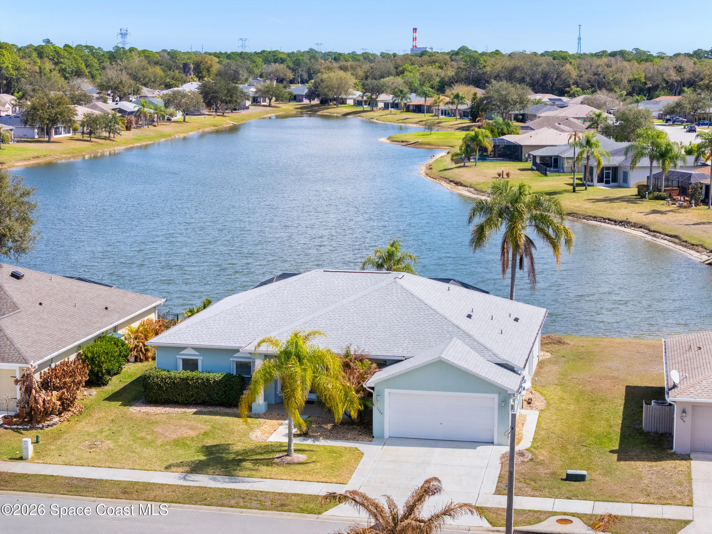 7429 Hackberry Road Cocoa, FL 32927 - Photo 44 of 51 a view of a swimming pool with a table and chairs