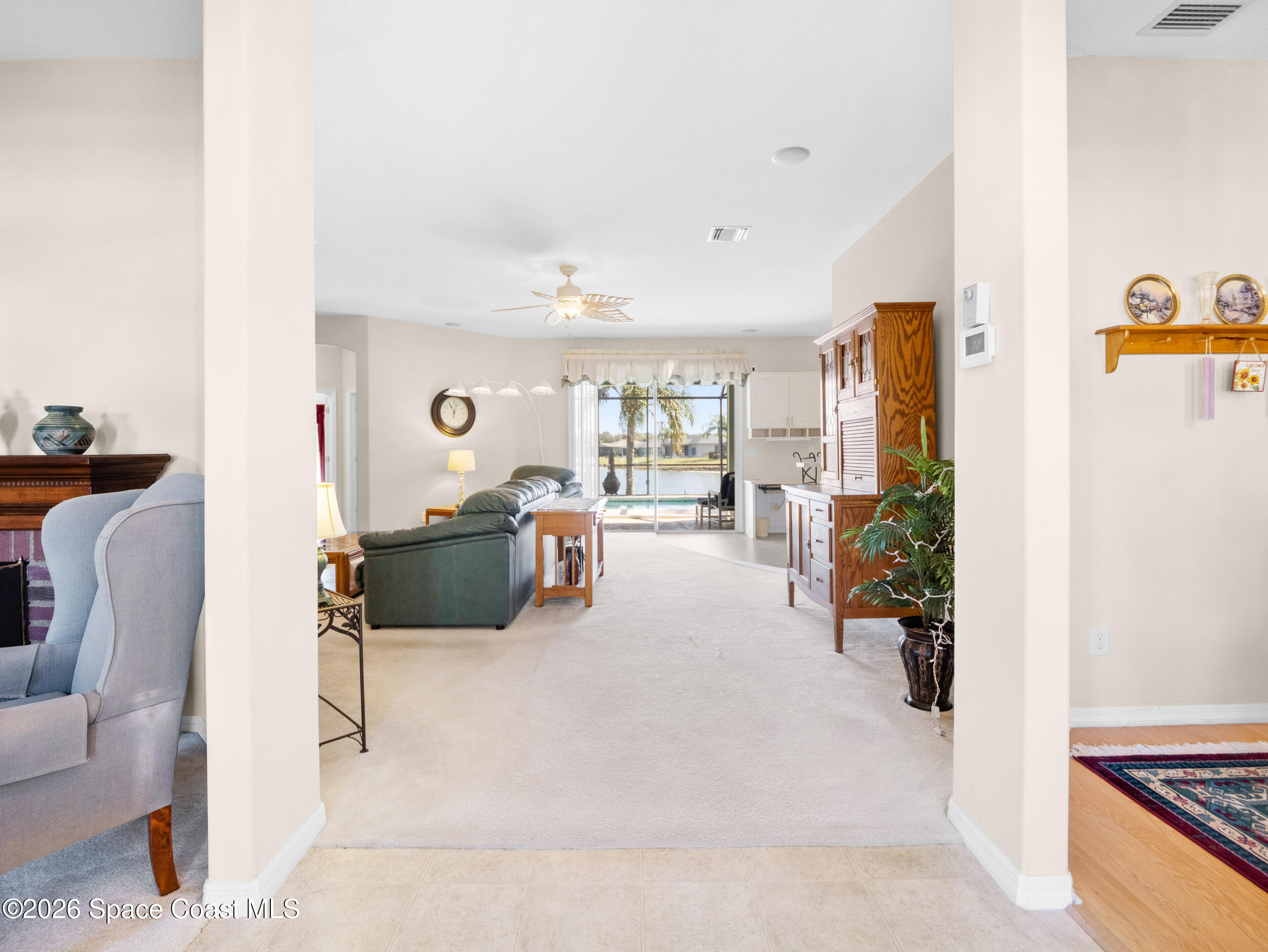 7429 Hackberry Road Cocoa, FL 32927 - Photo 5 of 51 a living room with furniture and a table with potted plant