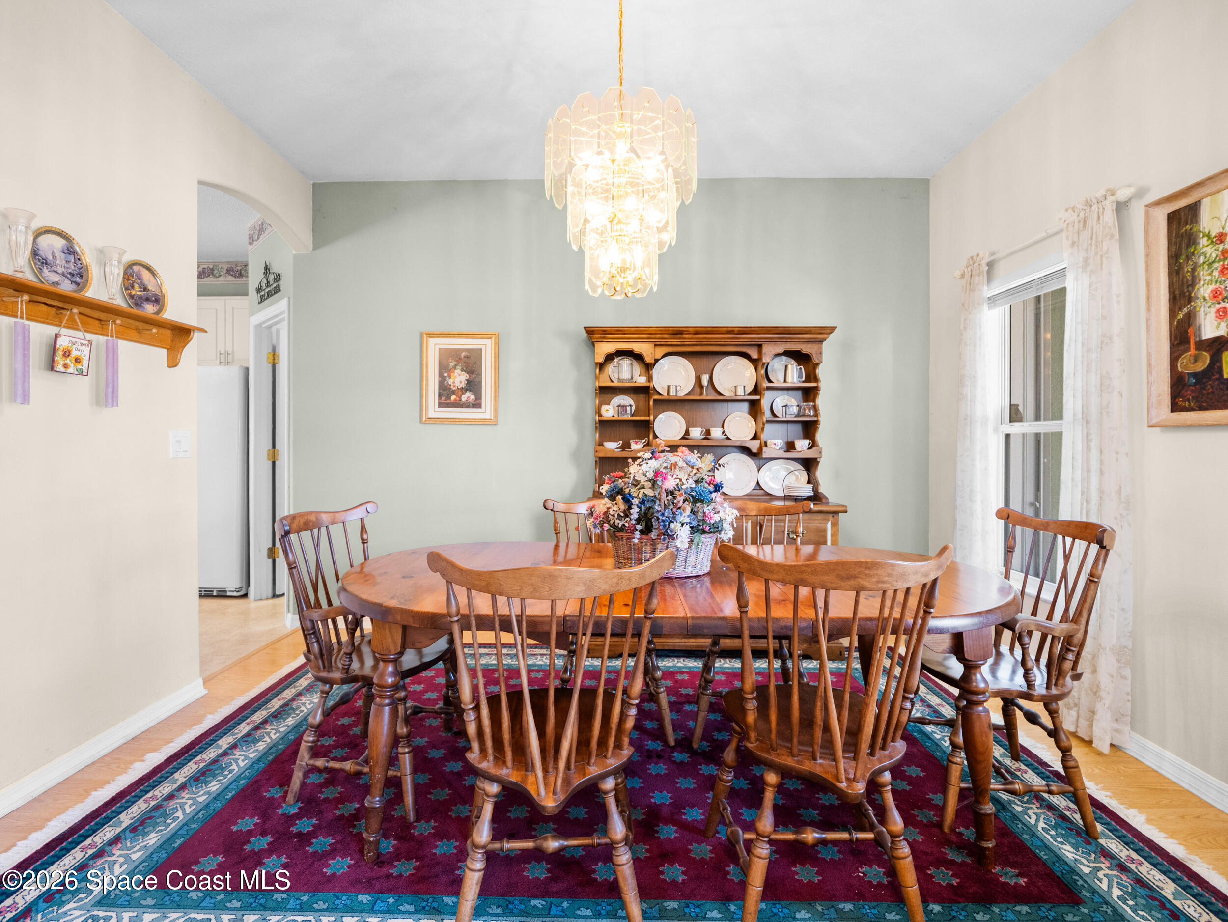 7429 Hackberry Road Cocoa, FL 32927 - Photo 7 of 51 a view of a dining room with furniture and chandelier