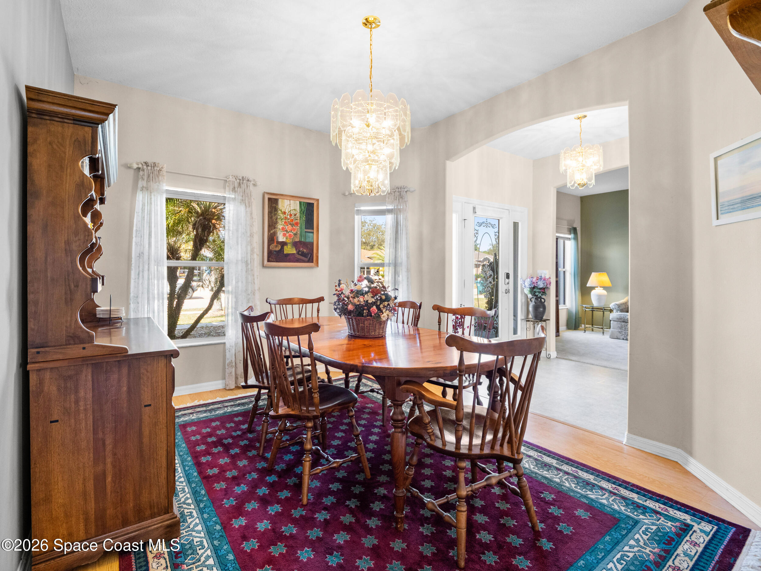 7429 Hackberry Road Cocoa, FL 32927 - Photo 8 of 51 a view of a a dining room with furniture window and wooden floor