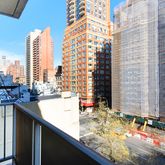 a bathroom with a granite countertop sink and a large mirror