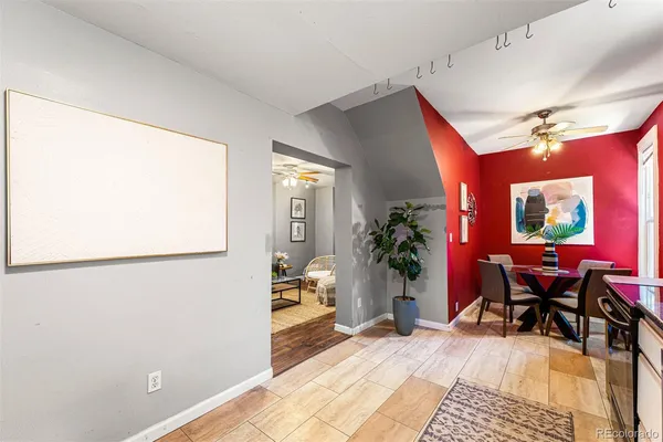 a view of a livingroom with furniture and a potted plant