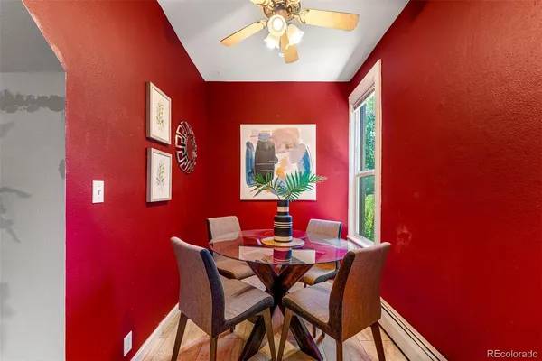 a dining room with furniture and window