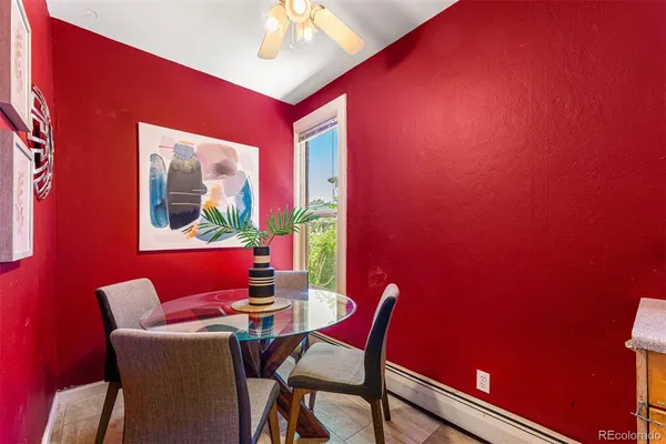 a dining room with furniture and window