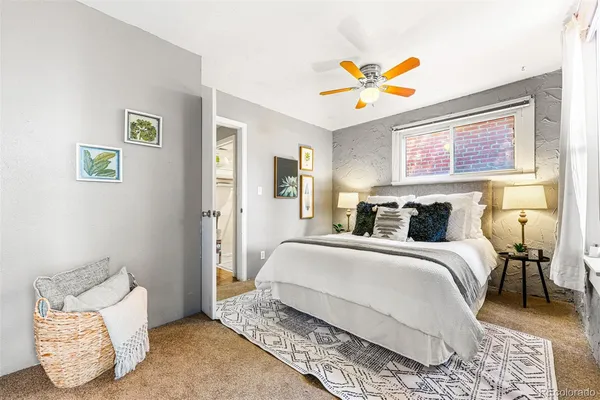 a bedroom with a bed and a couch