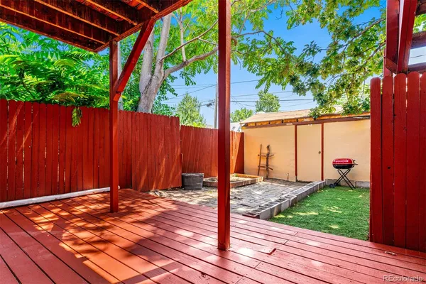 a view of a backyard with a sitting area