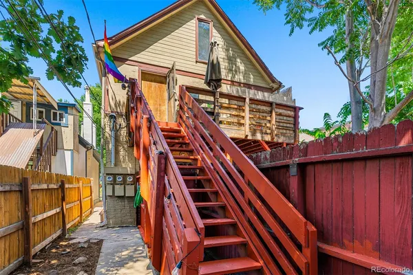 a view of outdoor space with deck and wooden stairs