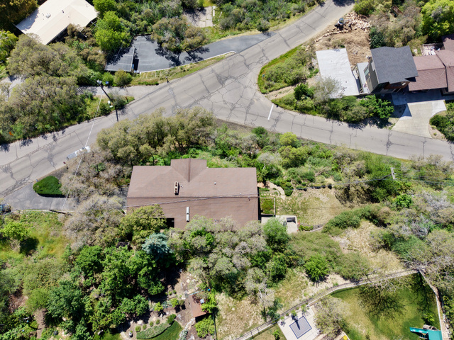 1900 North 100 East Provo, UT 84604 - Photo 45 of 49 Terraced property featuring a brown shingle roof, mature landscaping, and multi-level outdoor spaces