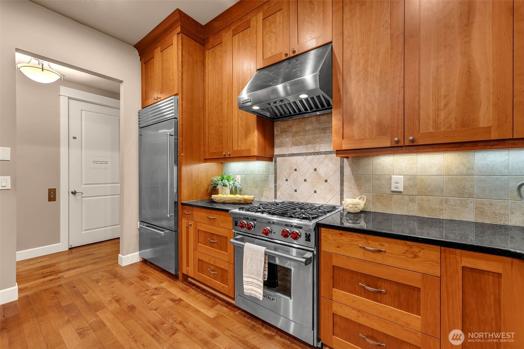 4029 Northwest 77th Avenue Camas, WA 98607 - Photo 12 of 32 a kitchen with stainless steel appliances granite countertop a stove and a white cabinets