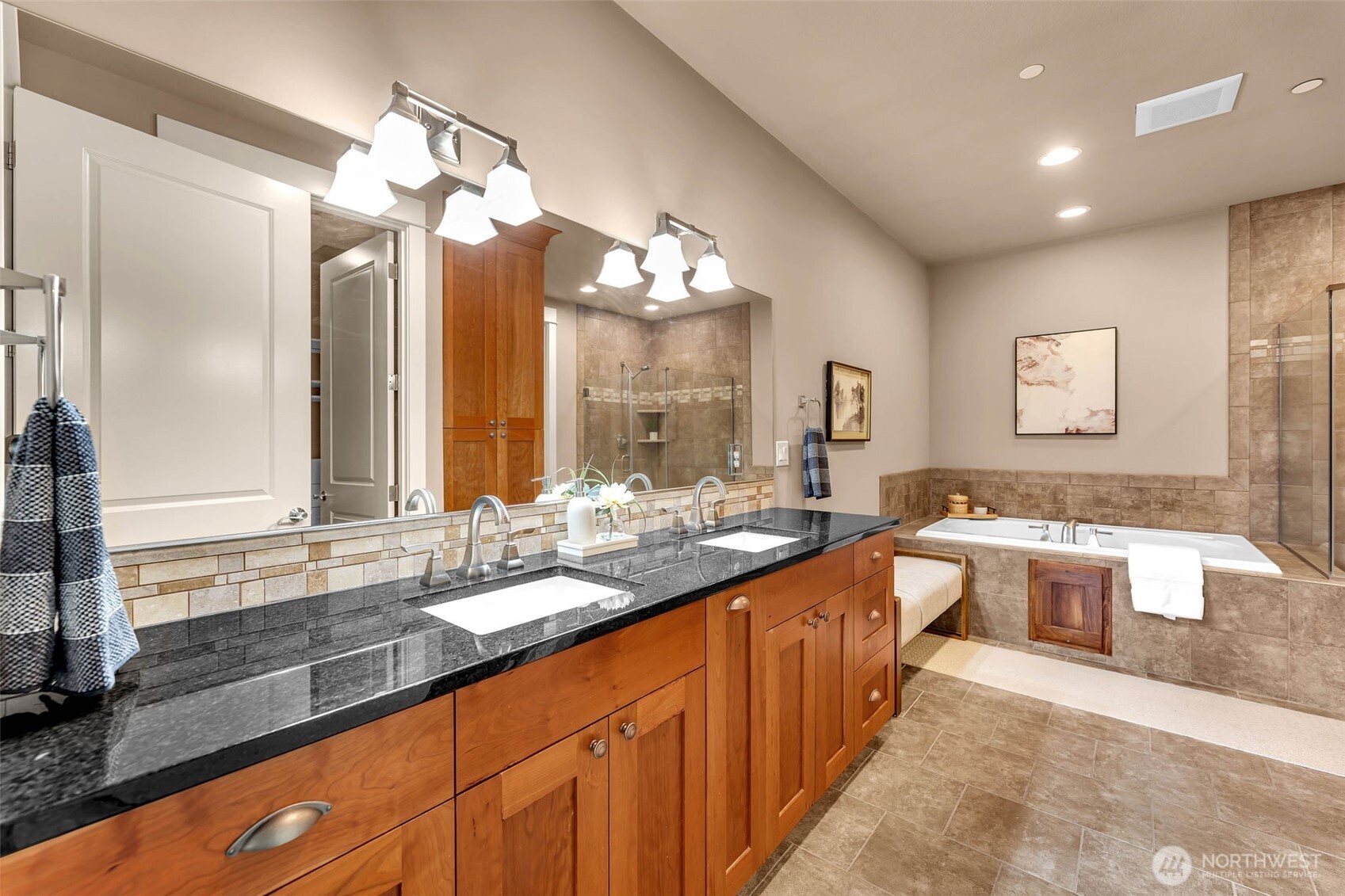 4029 Northwest 77th Avenue Camas, WA 98607 - Photo 17 of 32 a large kitchen with a large counter top a sink and stainless steel appliances