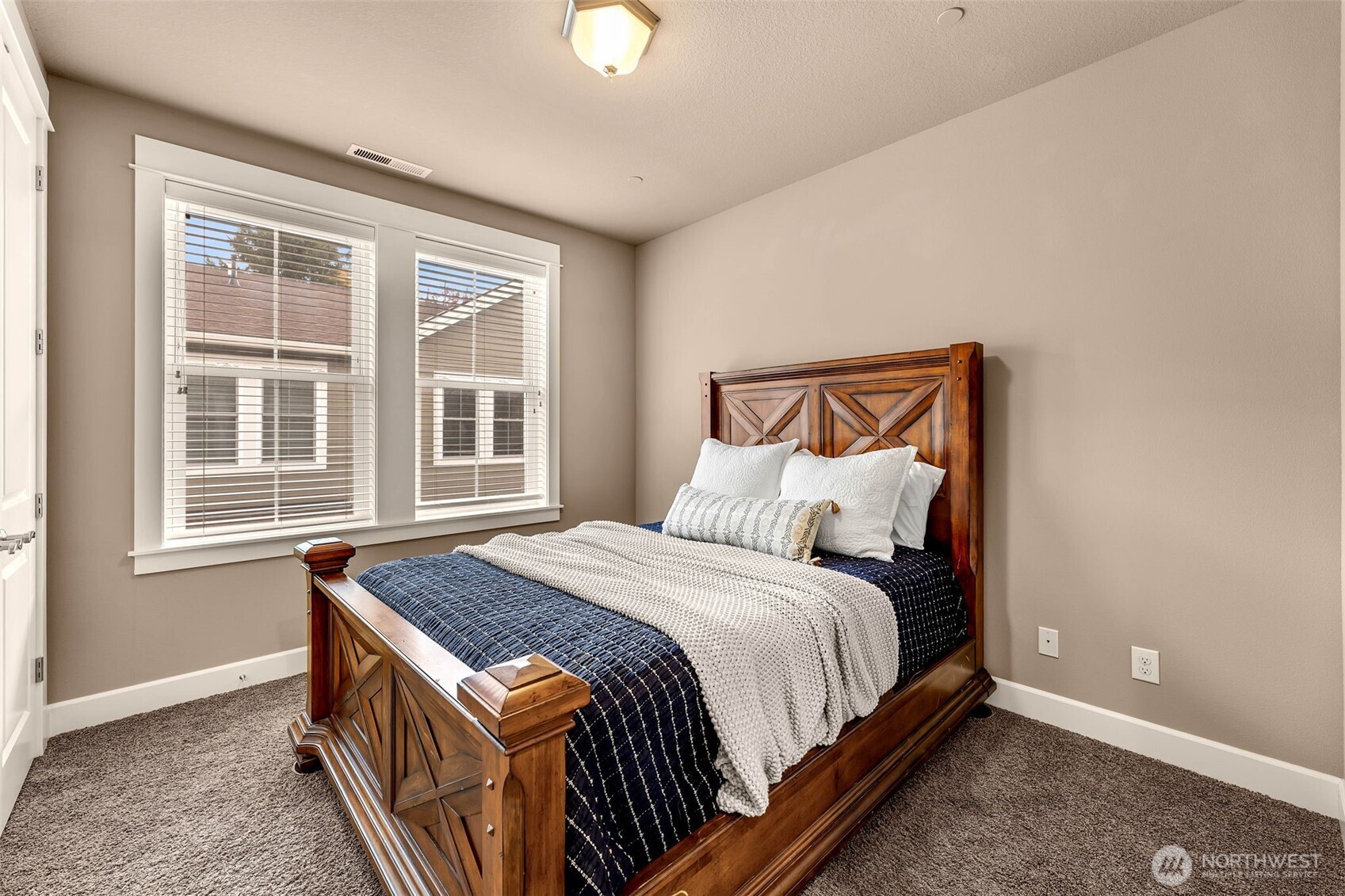 4029 Northwest 77th Avenue Camas, WA 98607 - Photo 24 of 32 a bed sitting in a bedroom next to a window