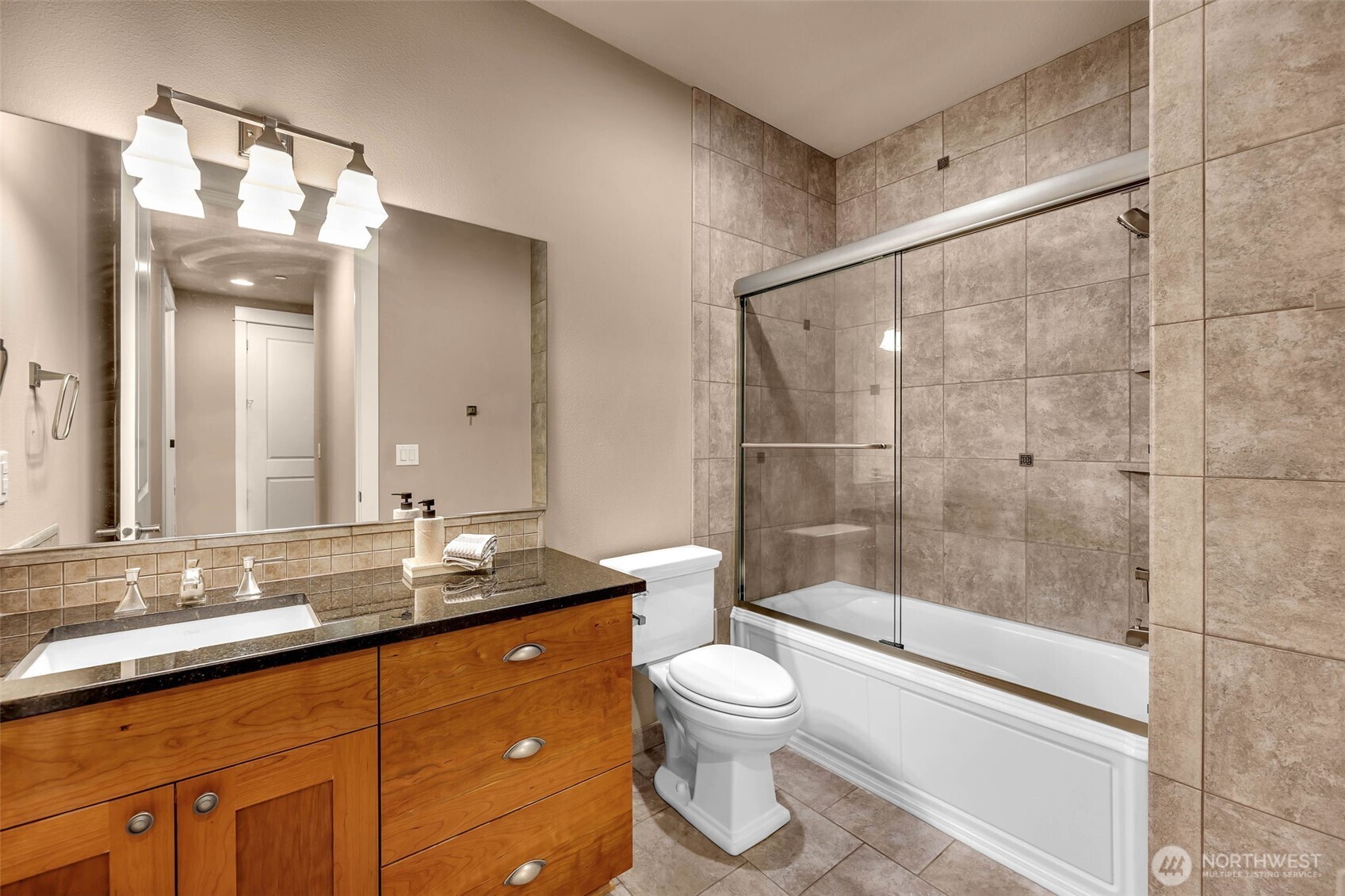 4029 Northwest 77th Avenue Camas, WA 98607 - Photo 25 of 32 a bathroom with a granite countertop sink toilet and shower