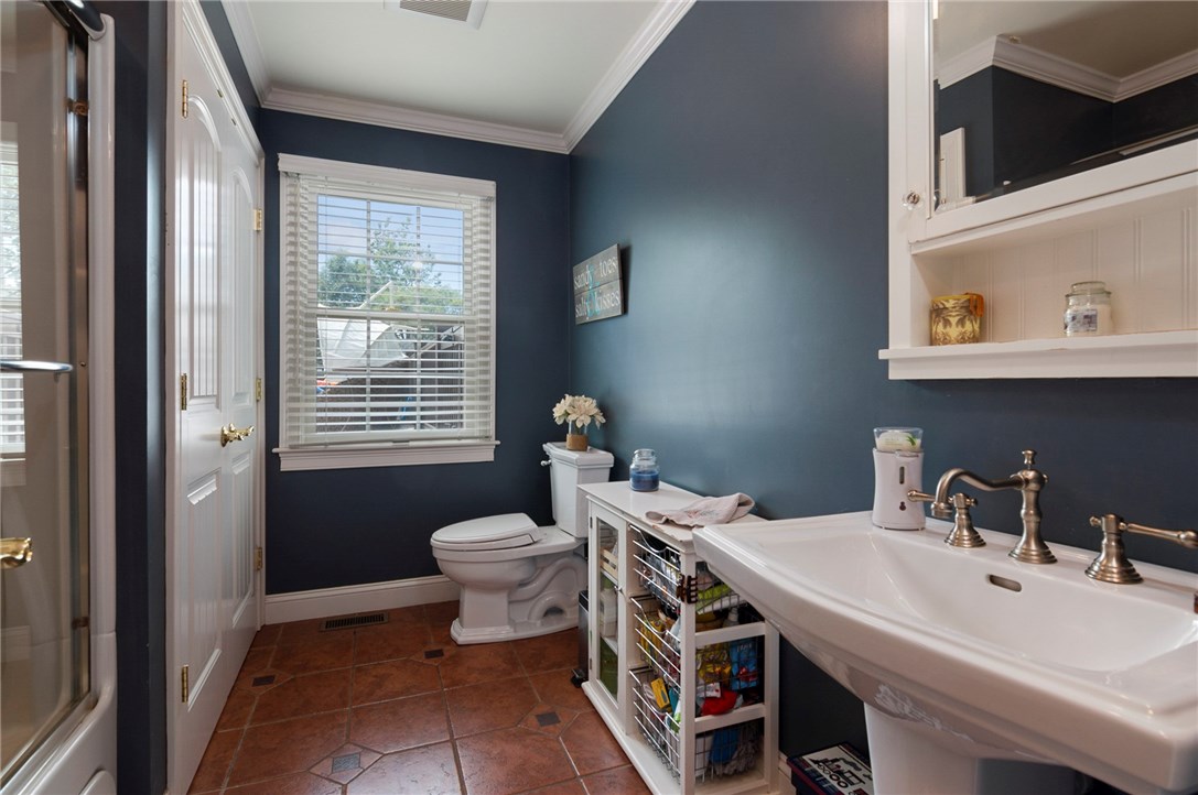 36 Seneca Road Portsmouth, RI 02871 - Photo 20 of 48 First floor full bathroom with jetted tub, and washer and dryer area.