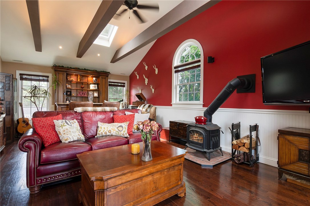 36 Seneca Road Portsmouth, RI 02871 - Photo 21 of 48 Second floor living room with wood stove.