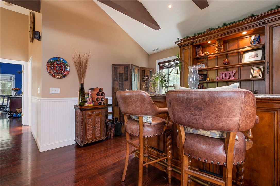 36 Seneca Road Portsmouth, RI 02871 - Photo 24 of 48 Second floor living room with a bar area.