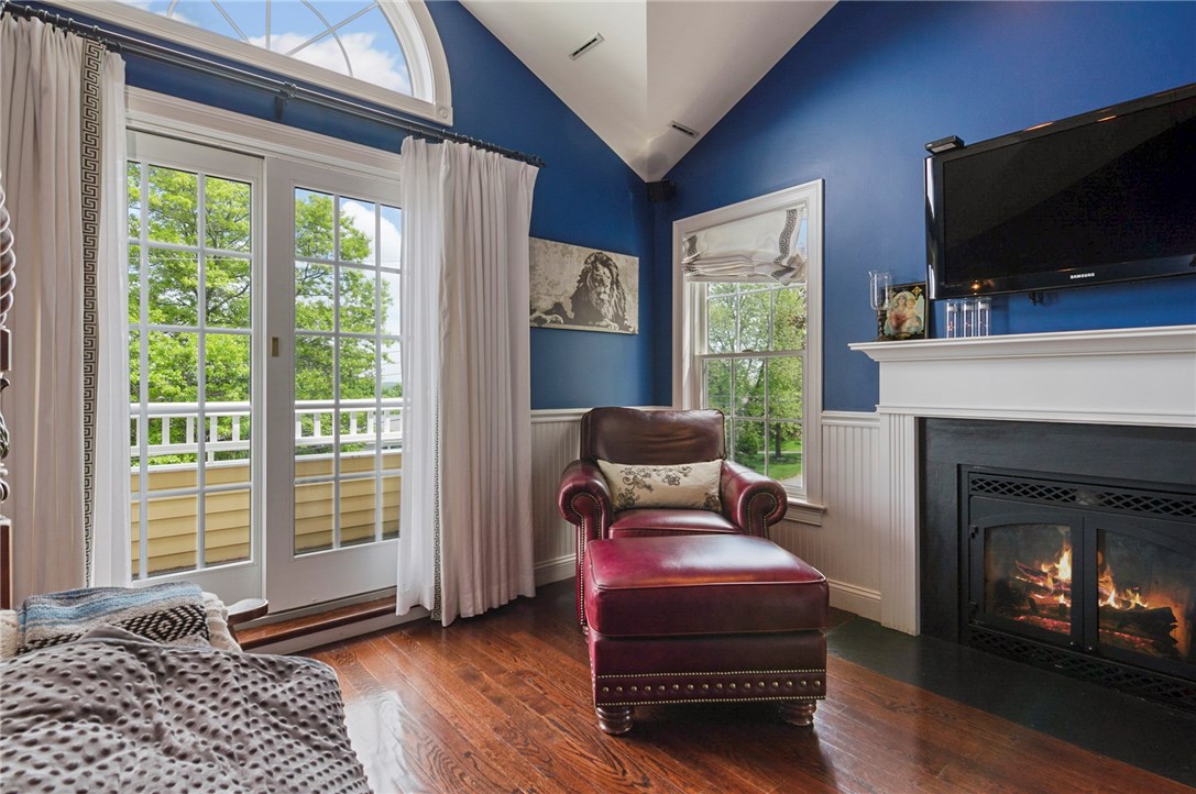 36 Seneca Road Portsmouth, RI 02871 - Photo 26 of 48 Master bedroom with water views and fireplace.